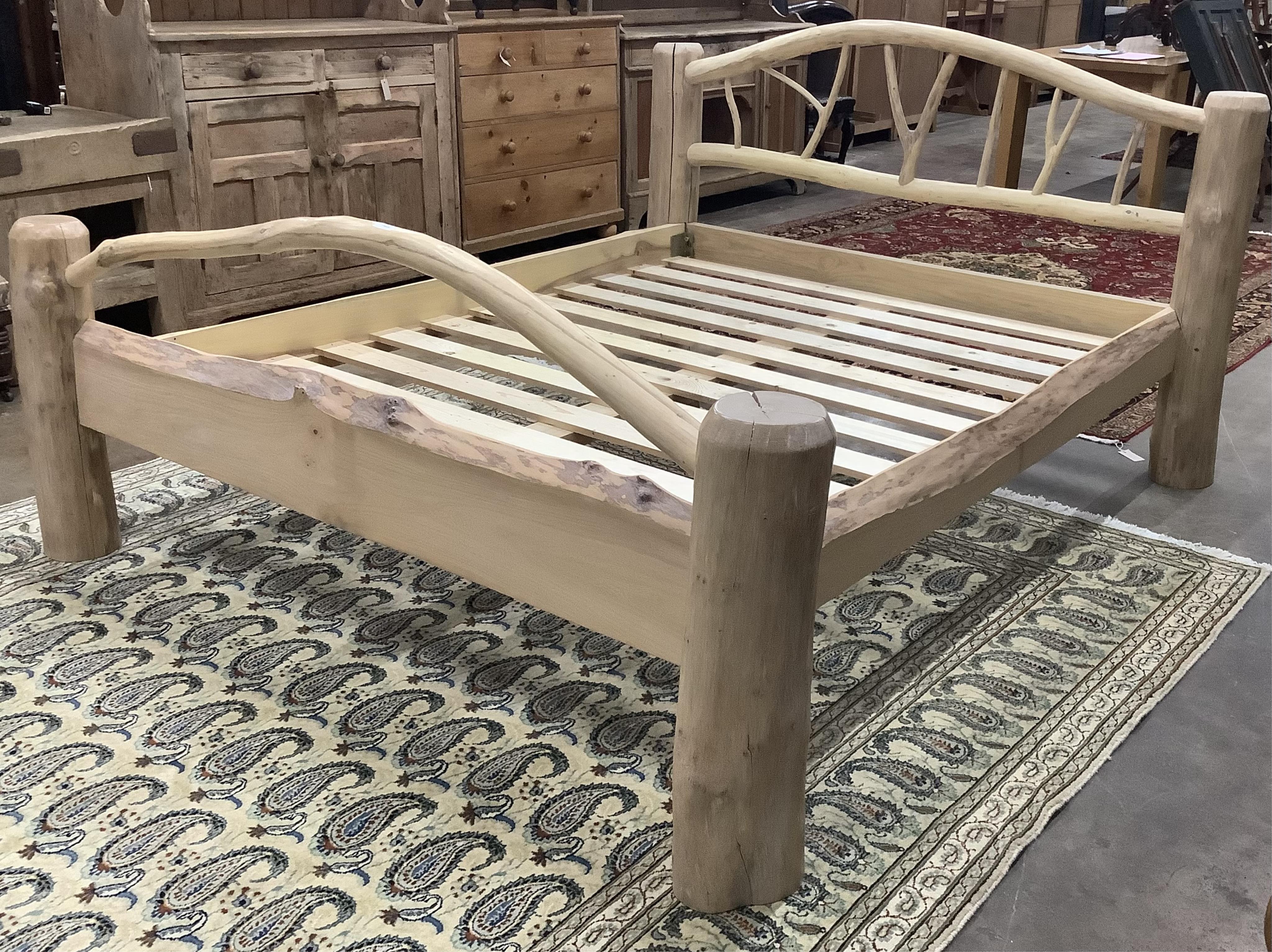 A bespoke rustic ash kingsize bed, width 180cm, length 215cm, height 108cm. Condition - good